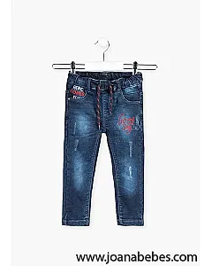 Pantalón de efecto vaquero de corte pitillo con bordados.